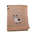 Cobija de lujo de 100% fibra de alpaca para bebé, doblada cuidadosamente para mostrar su color beige natural.
